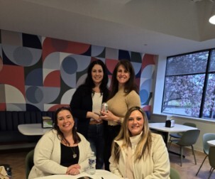 Lodestar employees smiling in cafeteria