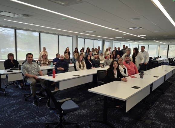 Lodestar group photo in meeting room
