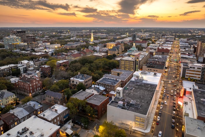 Aerial view of downtown city streets at sunset