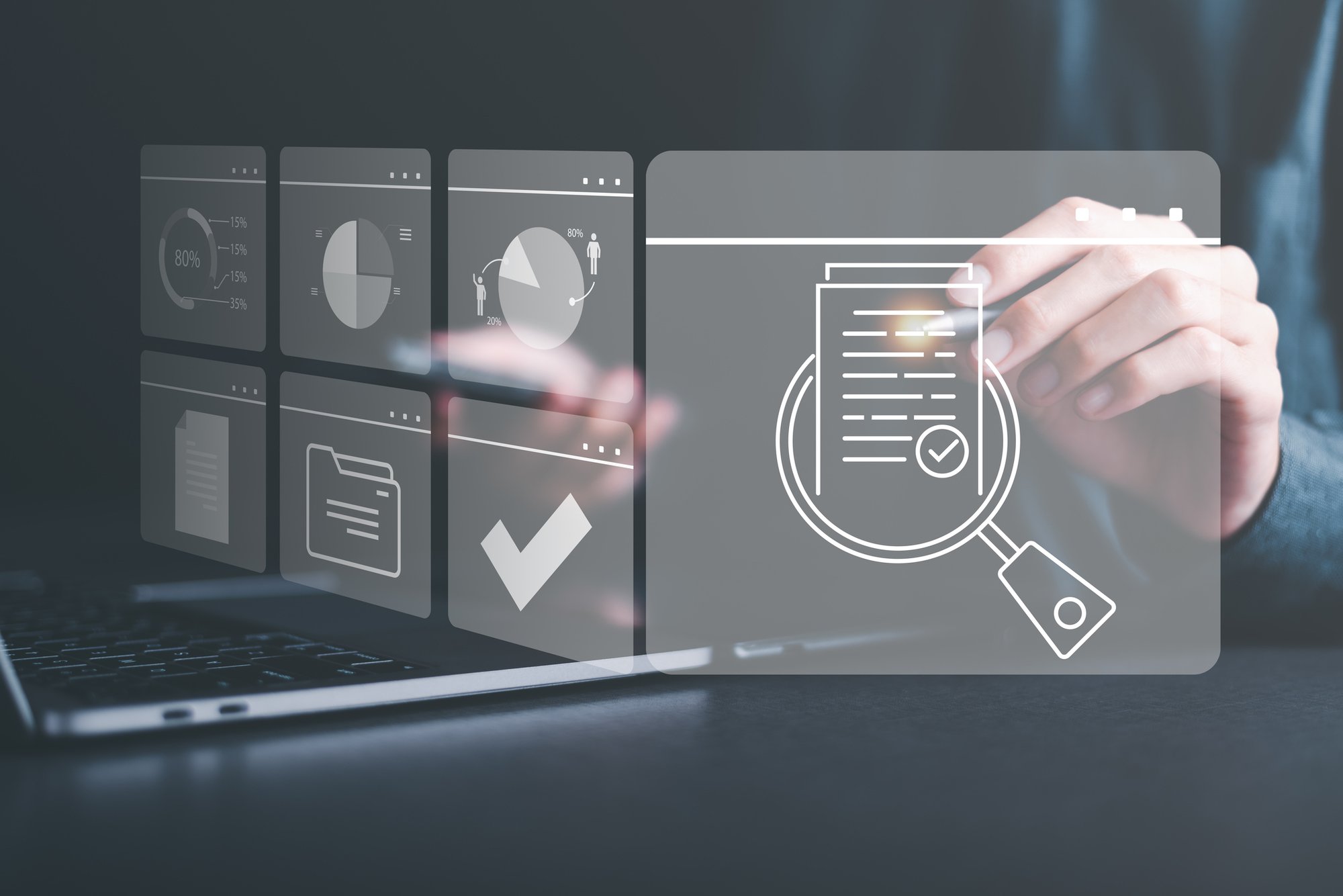 Office worker interacting with abstract chart and application holograms