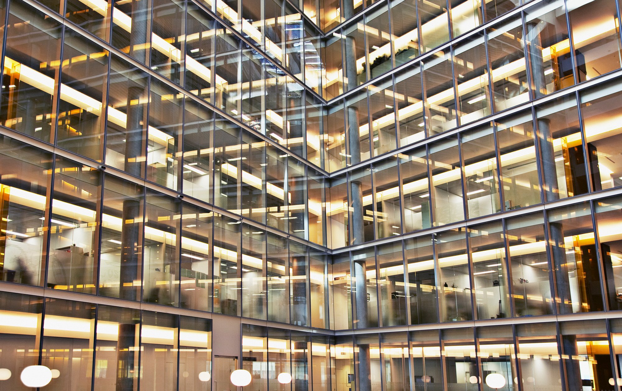 Modern hospital high rise building with floor to ceiling windows