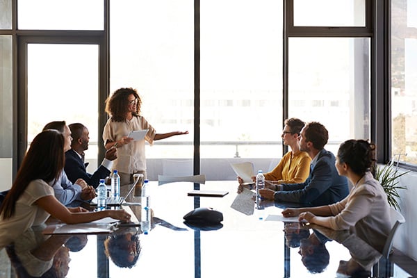Woman leading office meeting